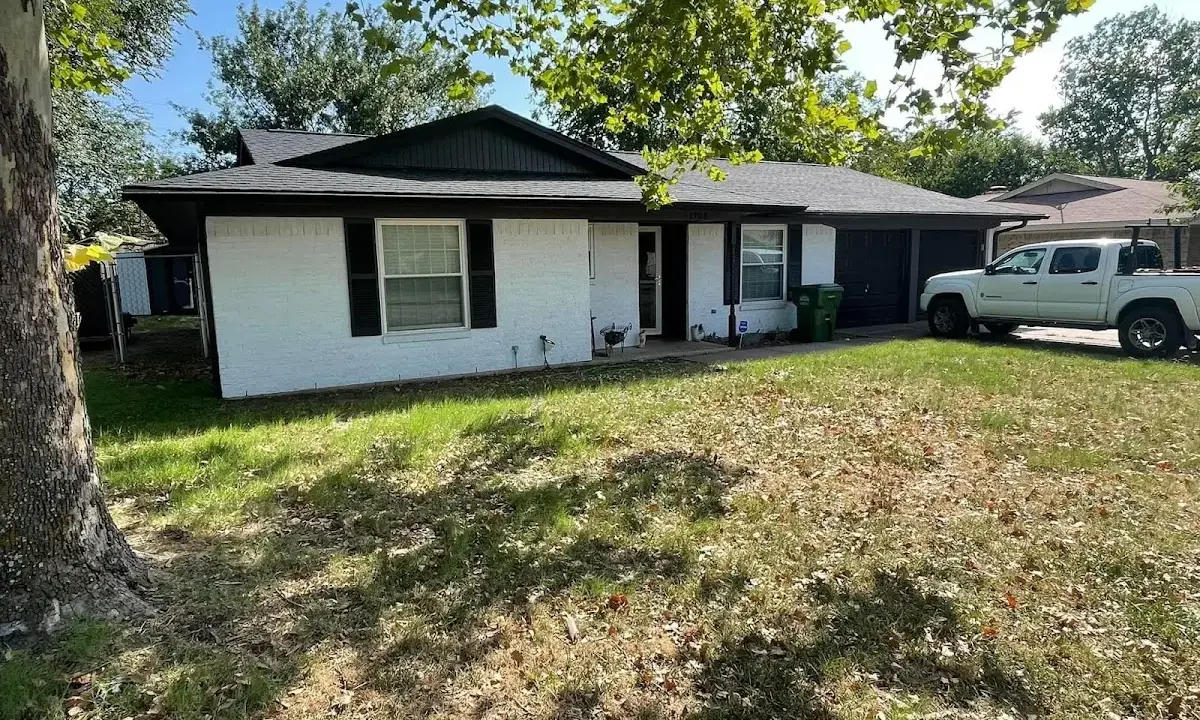 Professional roofing crew working on a residential roof in Fort Walton Beach